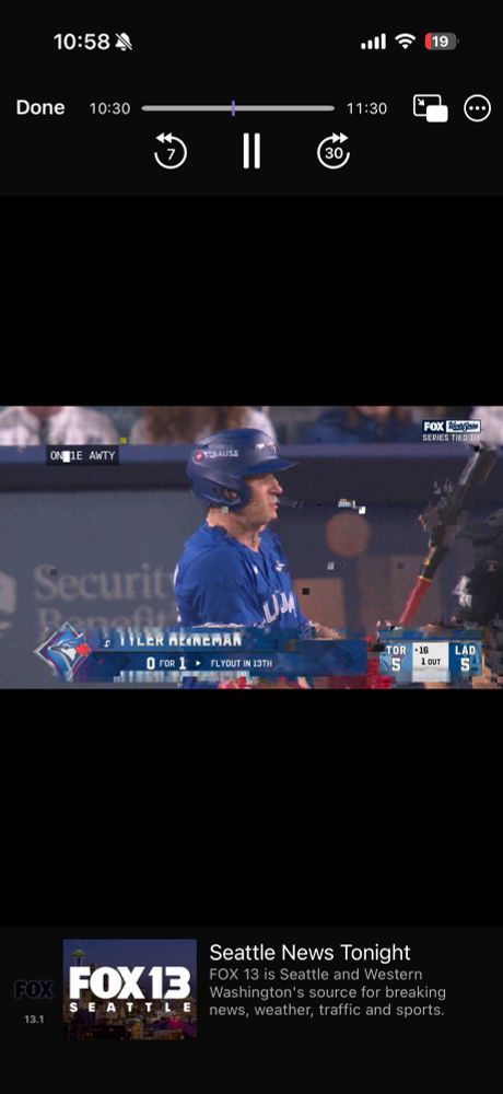 Distorted TV screen of baseball game with player at bat