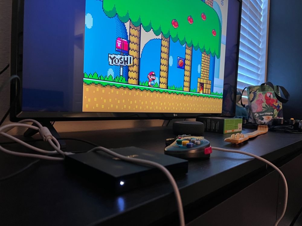 Different angle of the previous image, with the Fire TV more prominent and at a low angle.