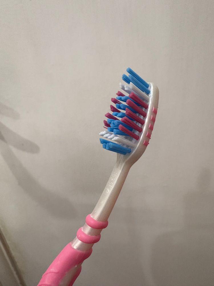 A toothbrush in the trans flag colours 