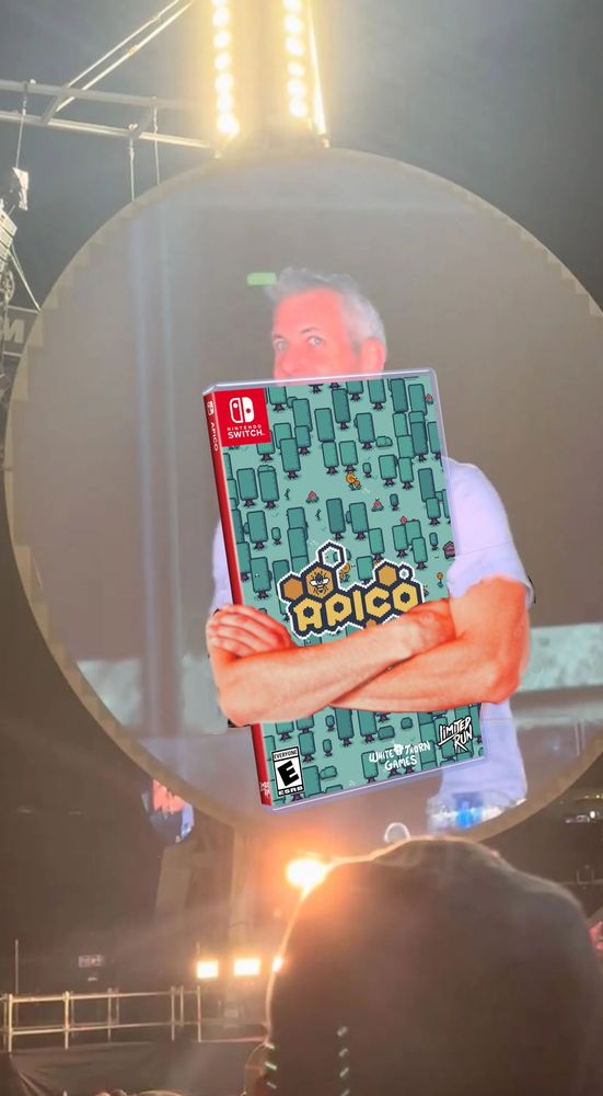 A photoshopped meme image of the Astronomer CEO at the Coldplay concert, but instead of putting his arms around a woman, he is holding a physical copy of Apico released by Limited Run Games. 
