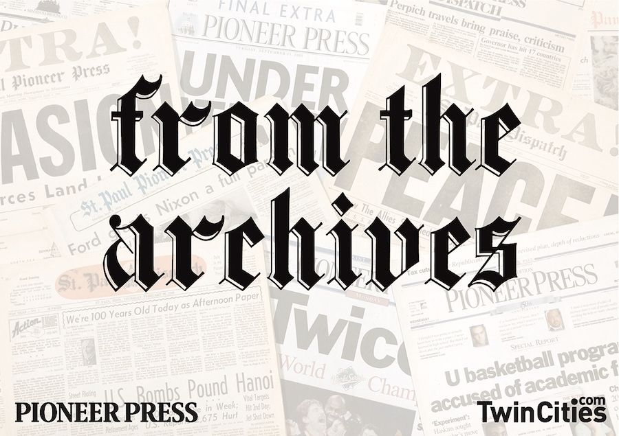 The words "From the Archives" in a gothic script against a background of newspaper front pages.
