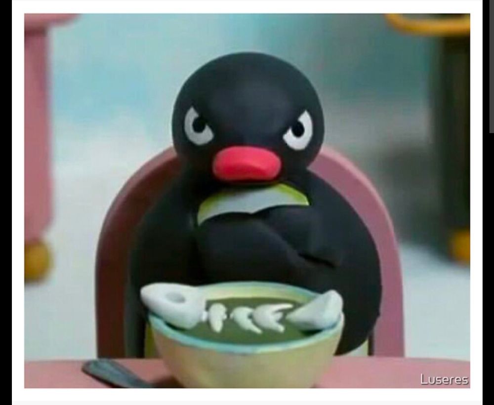 Pingu with a bowl of halászlé looking angy