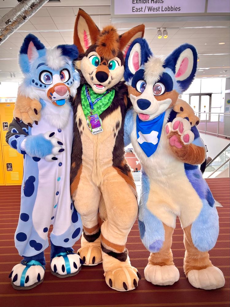 three fursuiters posing for the camera