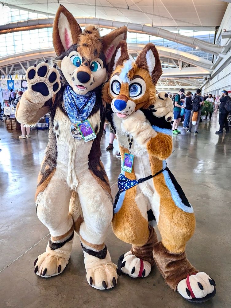two fursuiters pose for the camera 