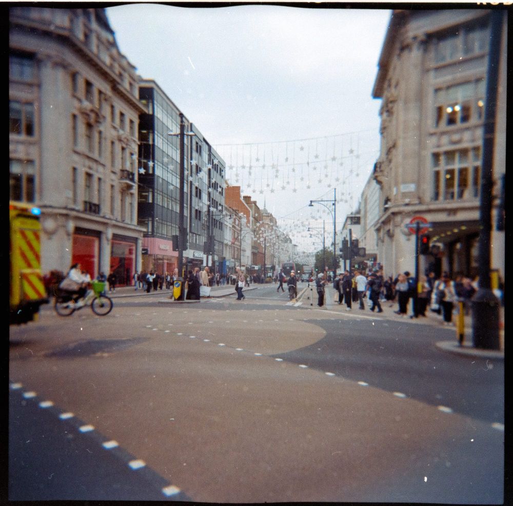 holga photo of oxford circus, a wide circular crossing area in the heart of london's shopping district