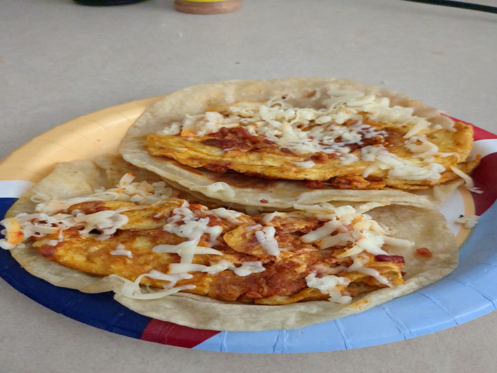 Eggs and chorizo with cheese tacos