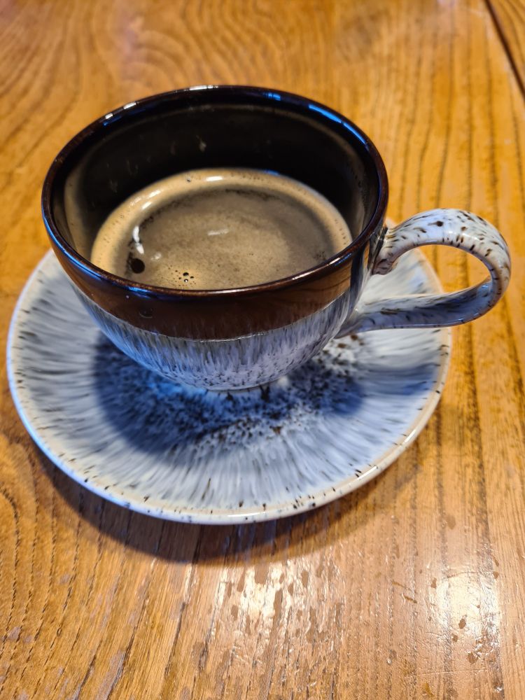 Cup of coffee brewed from beans, at home.