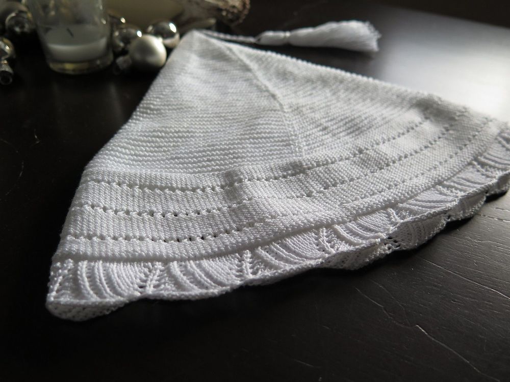 Knitting night hat laying on table.