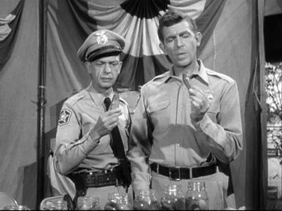 Scene from Andy Griffith where they are tasting Aunt Bee’s pickles. 