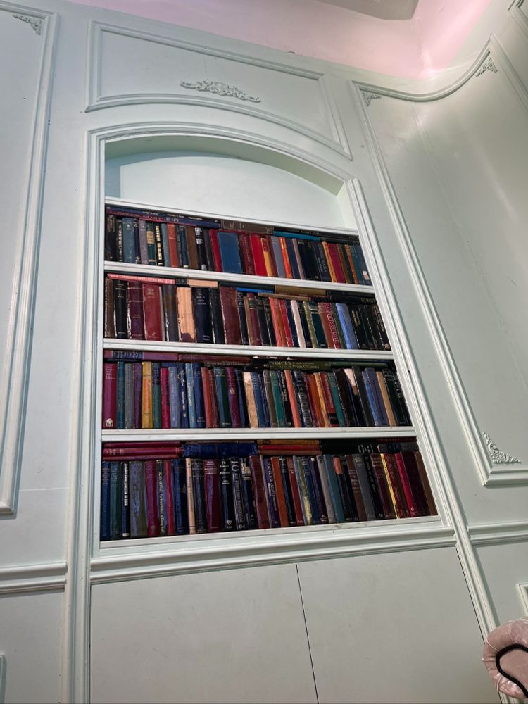 Closeup of spined vintage book stock in the bookcase