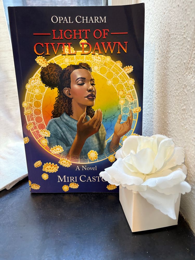 Image of book titled “Opal Charm: Light of Civil Dawn” featuring a Black girl on the cover next to a white flower