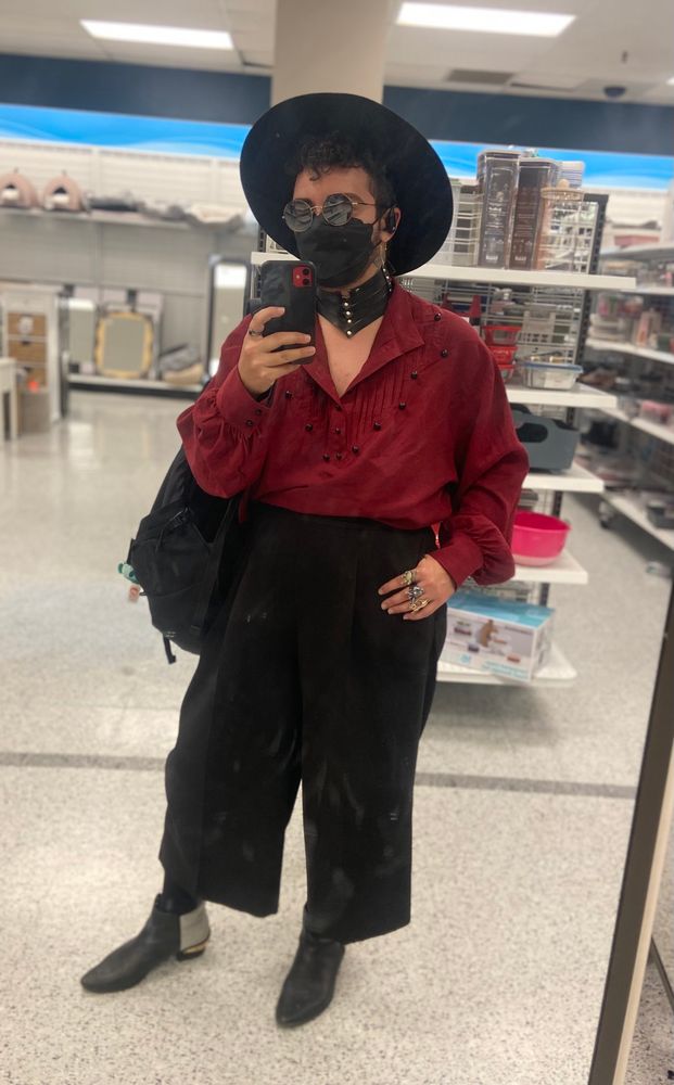 a selfie inside of ross (hush i had extra break time today to look around) featuring my wide leg trousers and gold-spiked ankle boots