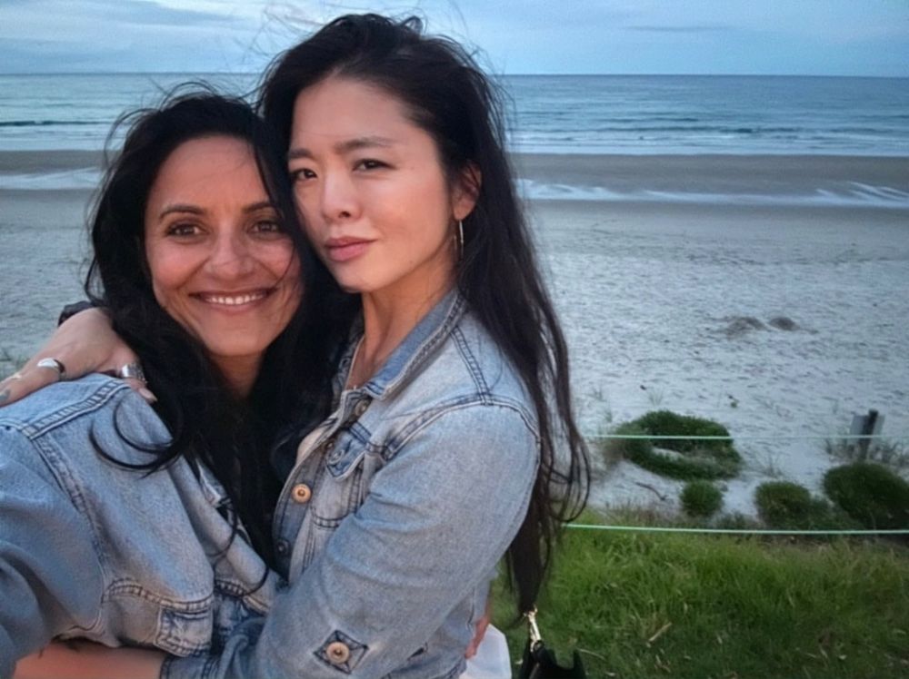 A selfie of madeleine and ruibo hugging at the beach from ofmd season 2 filming times
