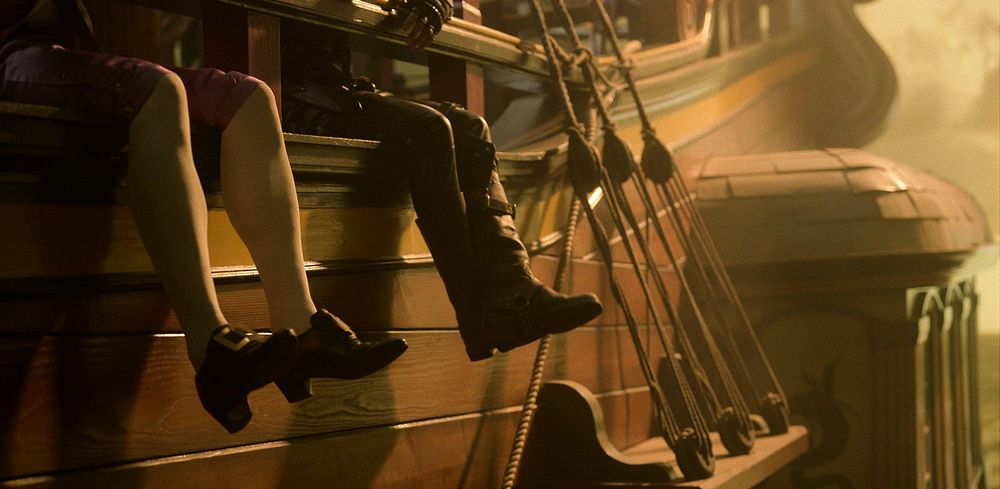 A picture from ofmd season 1 of stede and ed's feet hanging on the side of the ship 
