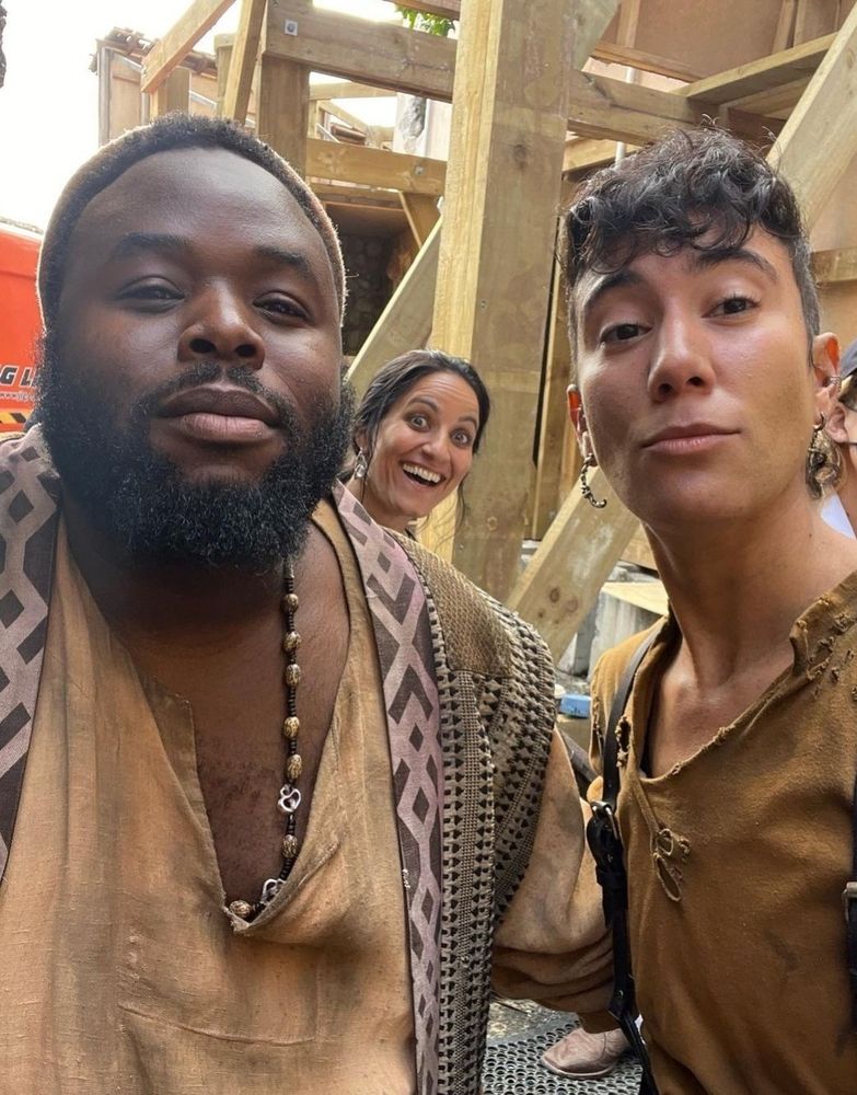 A behind the scenes selfie from ofmd of samson kayo and vico ortiz with madeleine sami photo bombing them in the back