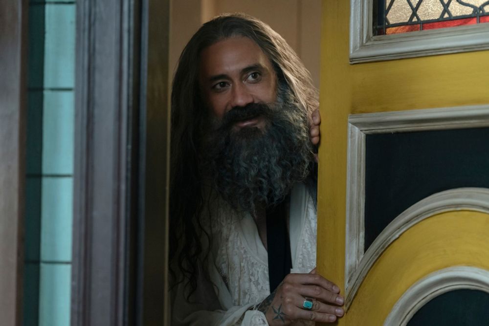 A still from ofmd season 1 episode 4 of ed peeking at the door looking at stede