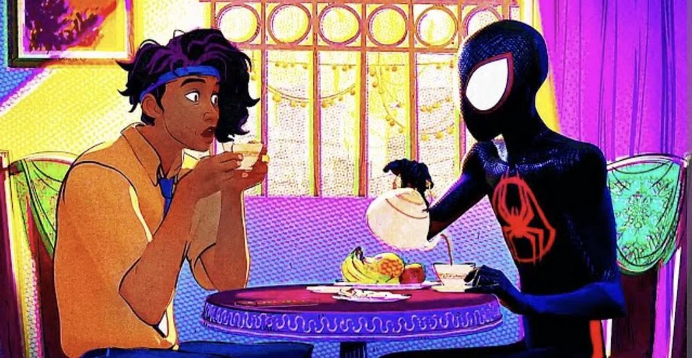 Still from Across the SpiderVerse right before Pavitr tells Miles that "chai tea" is like saying "tea tea"