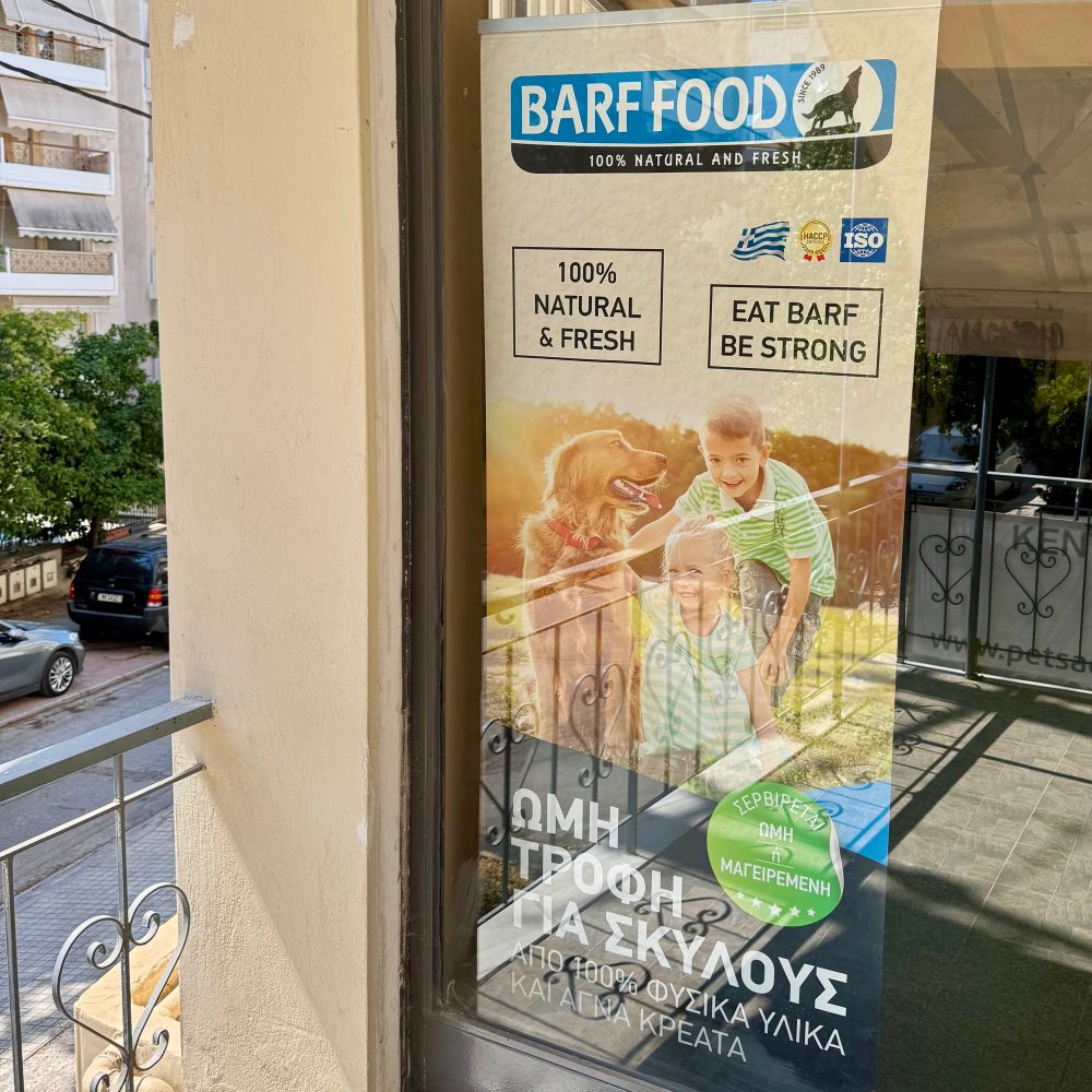 A pet shop poster for a dog food called barf