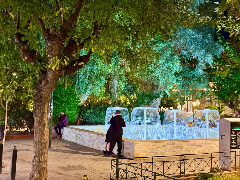 Fountains in a leafy square

