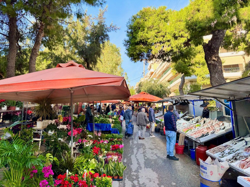 street market stalls selling fish n flowers