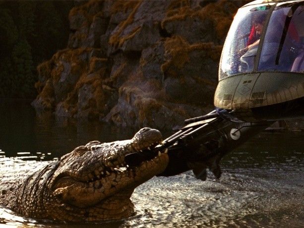 A giant alligator fighting a helicopter over a black life raft over the lake. 