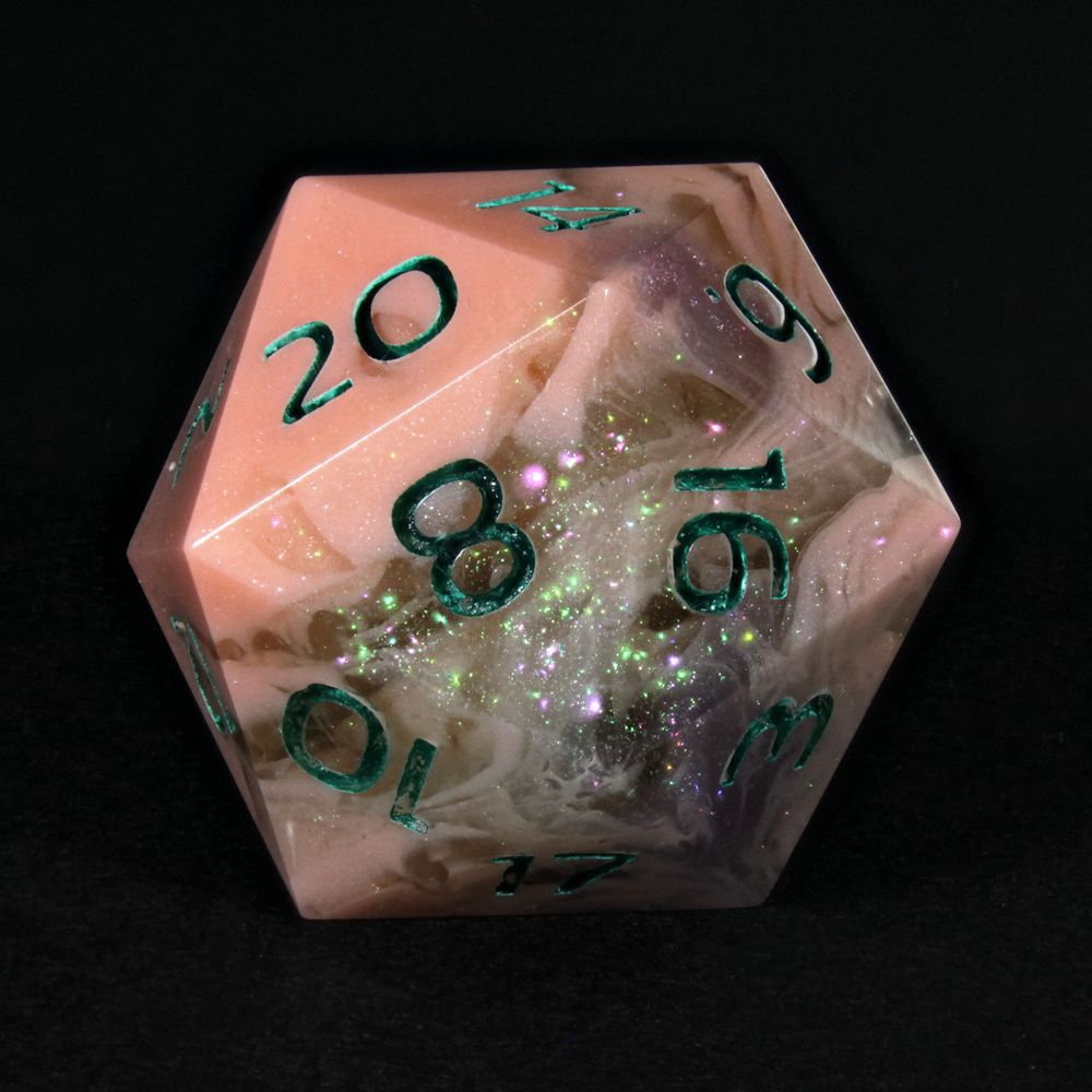 A single 20 sided die. It is a peach colour with greens and purple mixed through. The numbers are phthalo green