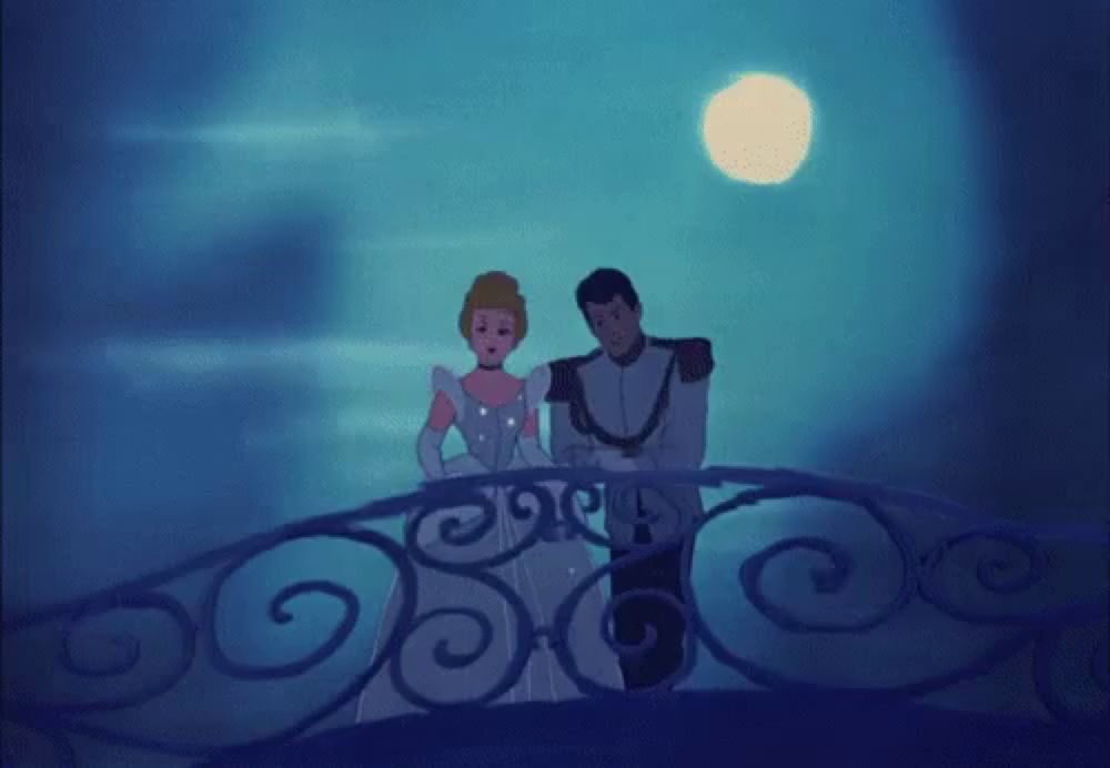 cinderella and prince charming are standing on a balcony with the moon in the background