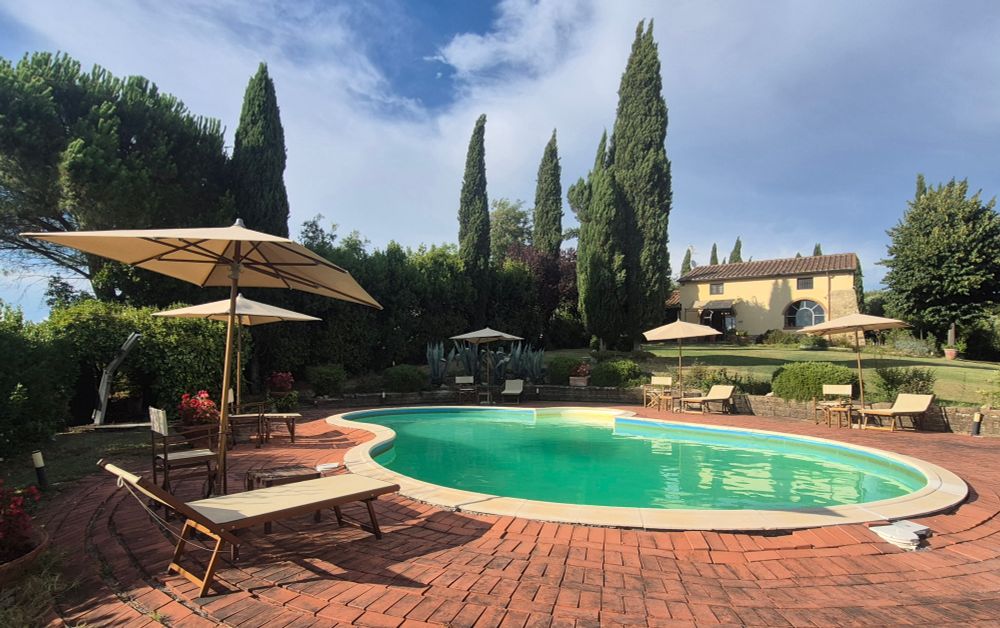 Pool with villa behind