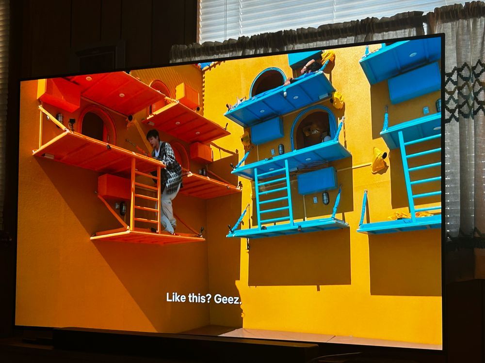 bTS Jin climbing onto hanging bunk beds on the Netflix show Kian’s B & B 