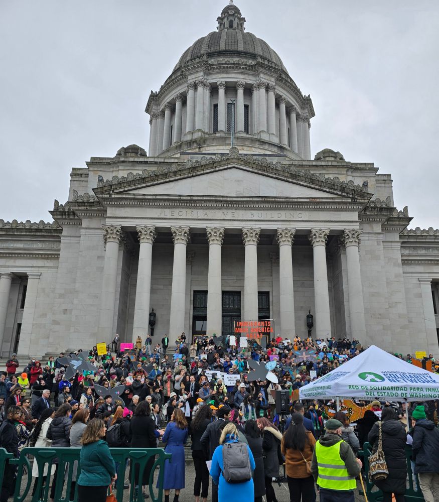 WA State Capitol Building in Olympia WA. Building steps and plaza covered with 1000+ people at the 50 Protests 50 States rally.