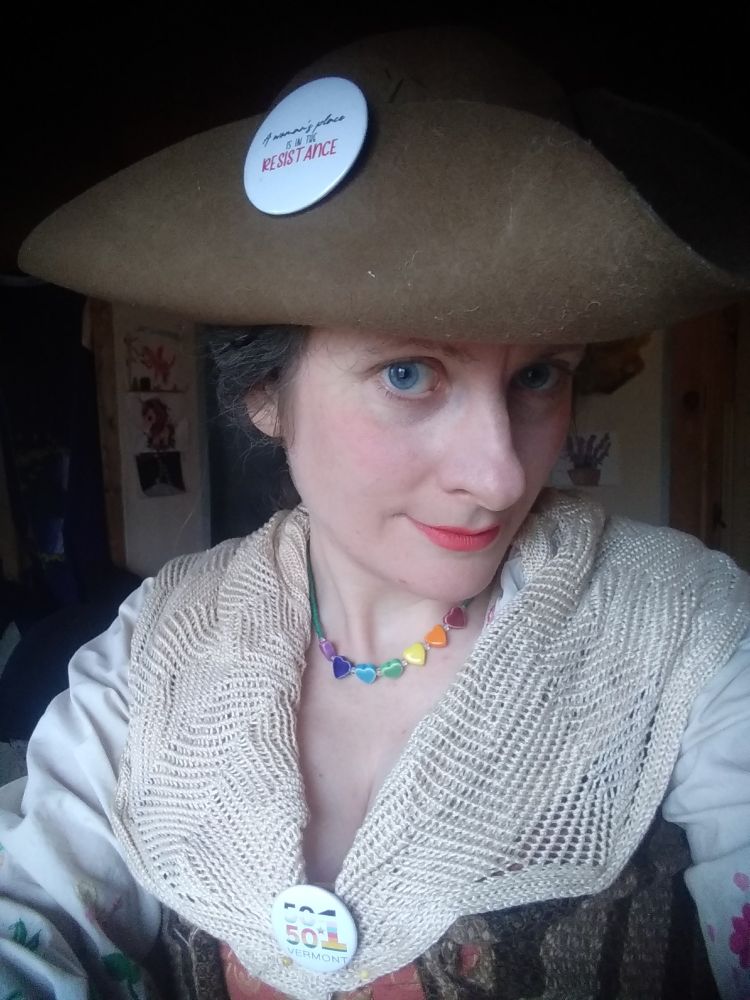 Woman in 1700s garb.