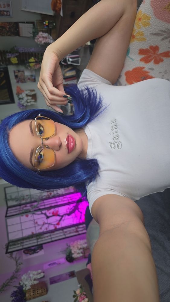 Mai is taking a selfie