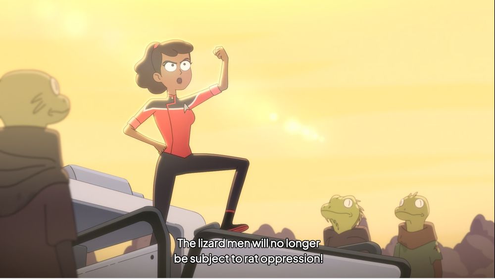 Beckett Mariner, standing ontop of a Sci-fi car with one fist raised like the coolest person ever. She is saying "The Lizard men will no longer be subject to rat oppression"