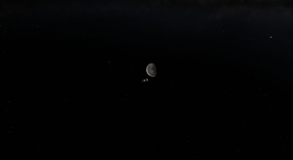 My Impactor probe, composed of an Antenna, a probe, and a solid rocket motor that is a dark yellow with an orange engine bell. It is on its way to impact the moon