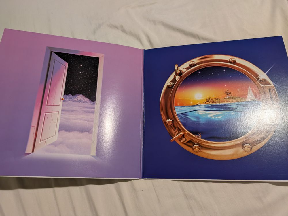 An image of a door leading to a misty mountain next to an image of a porthole on a ship looking out to an island in the water while the sun sets in the background