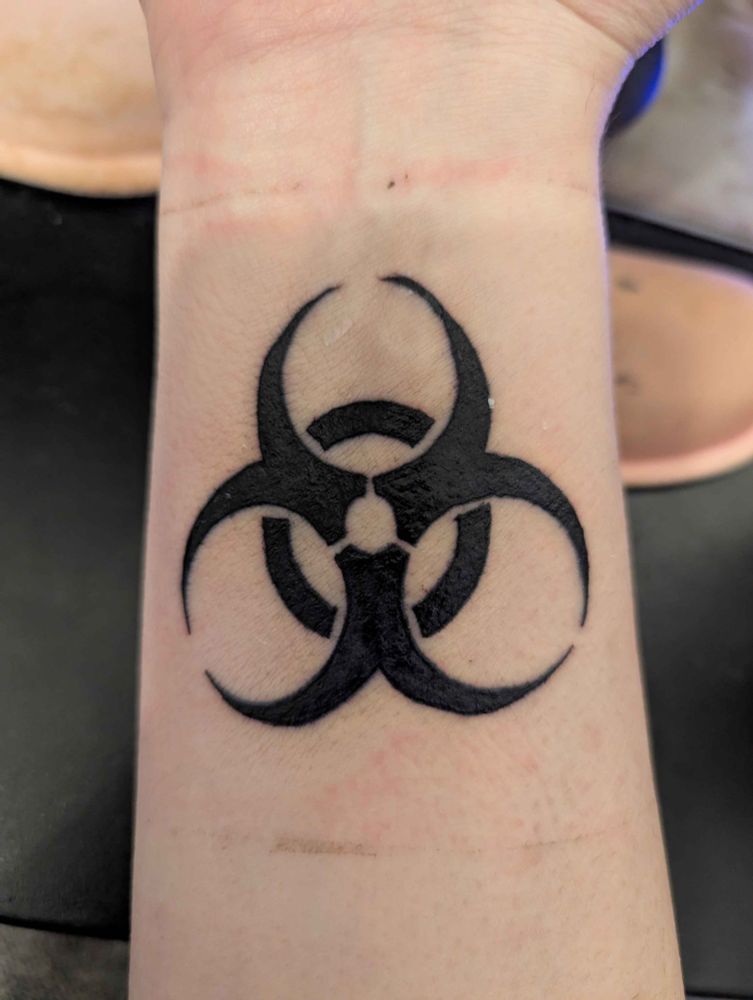 A tattoo of the biohazard symbol on my wrist. It looks so cool.