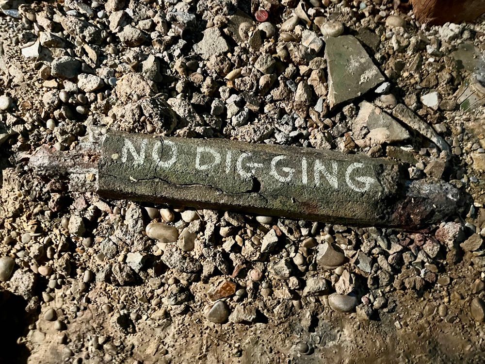 Part of the reconstructed foreshore of n the exhibition with a sign saying ‘no digging’