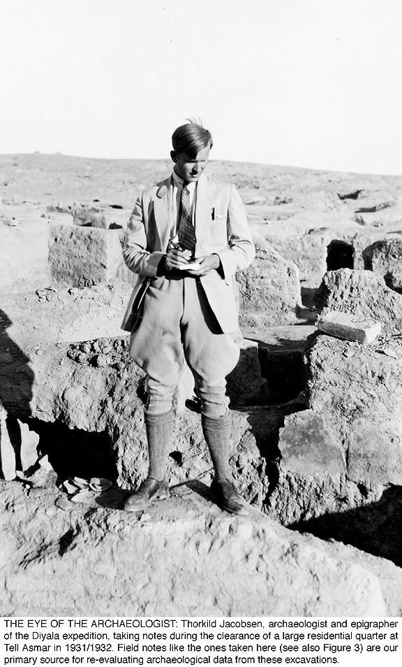 hot young thorkild jacobsen in the desert, wearing a suit coat, mid-calf boots, and jodhpurs