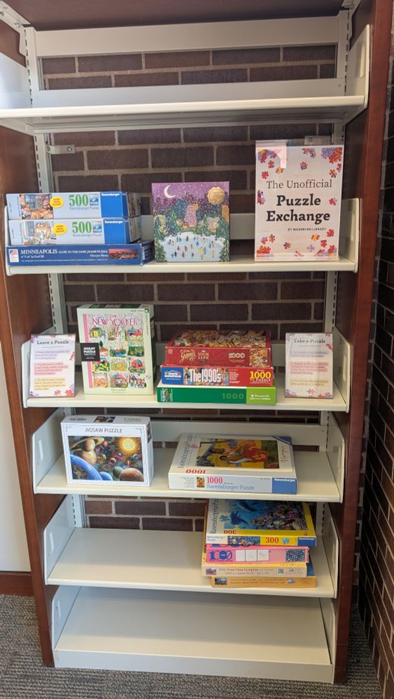 Bookshelf with free puzzles to exchange for the public. 