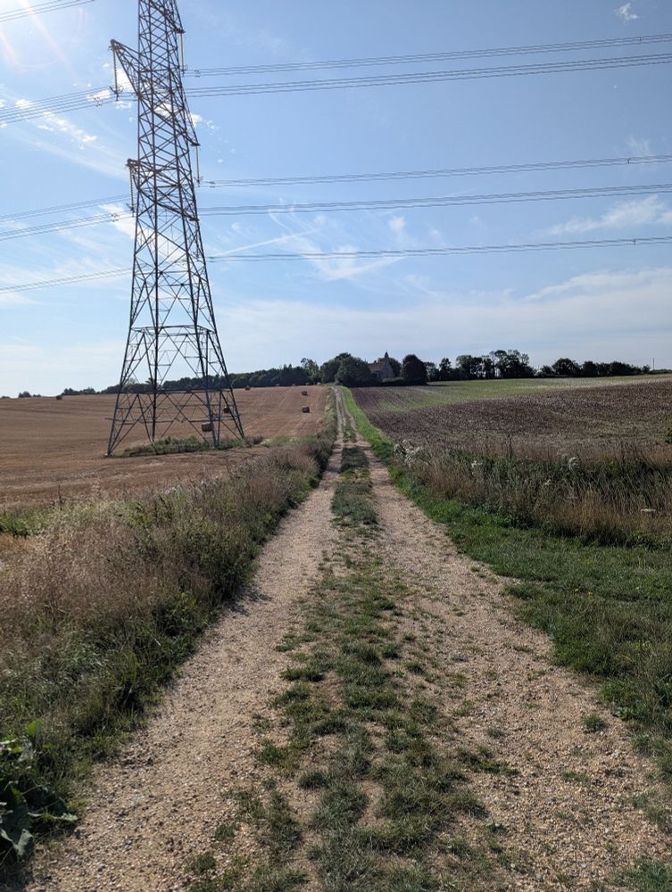 Field and pathway leading up to the church 