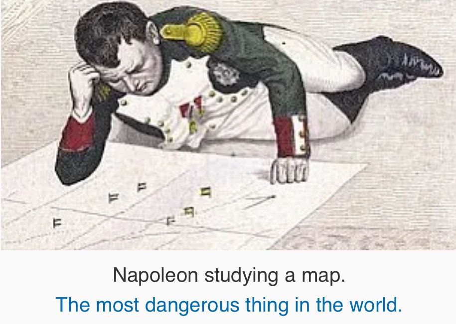 An illustration of Napoleon lying on the floor studying a map, captioned “Napoleon studying a map. The most dangerous thing in the world.”