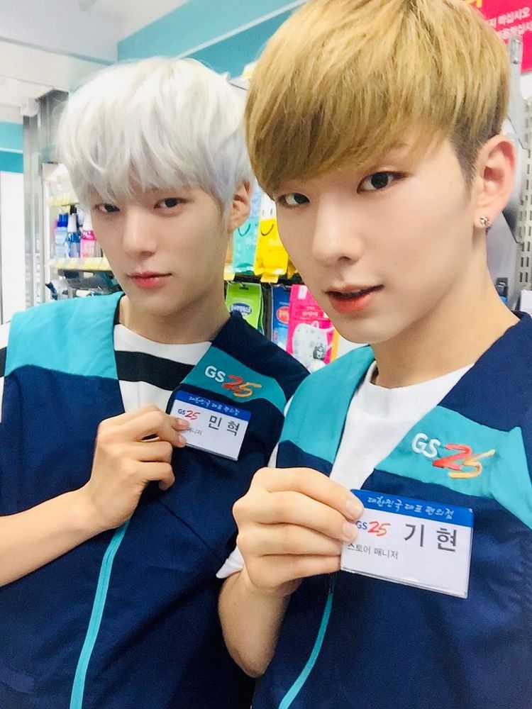 minhyuk and kihyun showing their name badges during rookie era