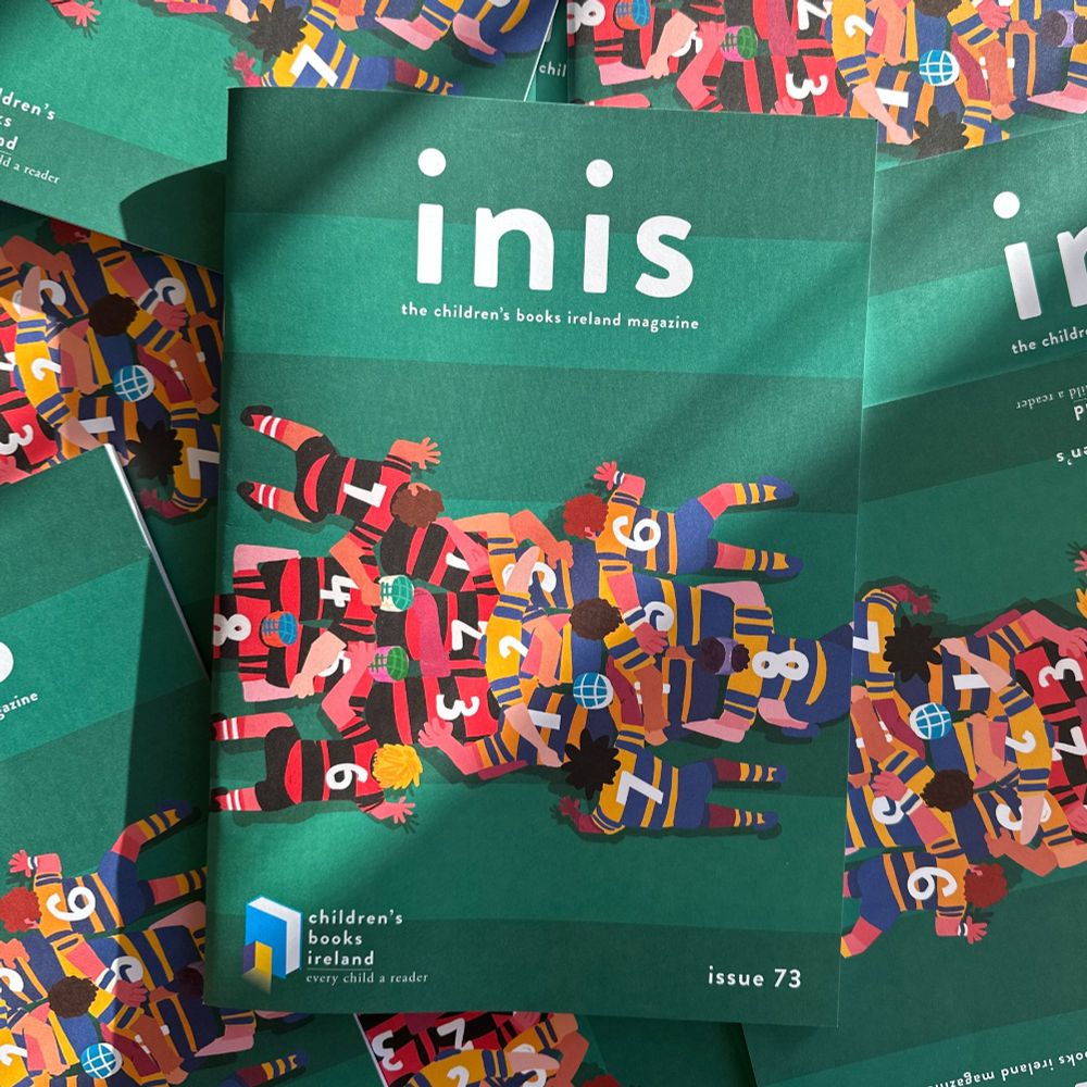 The cover of Inis 73 is a colourful illustration of a scrum from a birdseye view on a rugby pitch . It is illustrated by Ashwin Chacko

