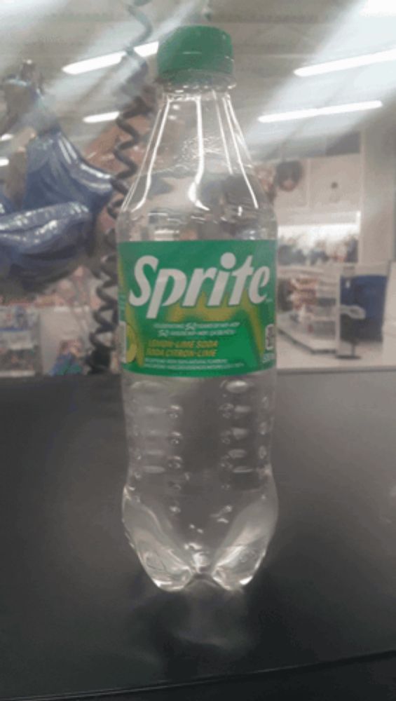 a bottle of sprite is sitting on a counter