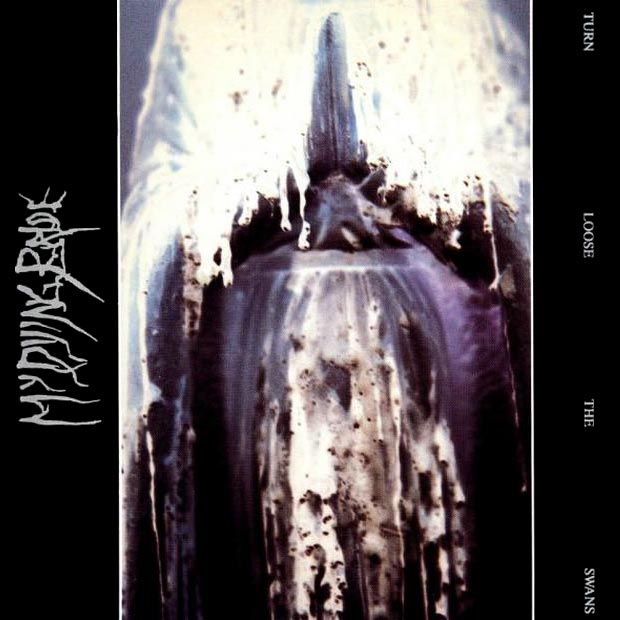 My Dying Bride - Turn Loose the Swans (1993). The album cover, an inverted photo of a praying figurine covered in melted candlewax, devoid from context embodies a similar shape to the interior of most churches.