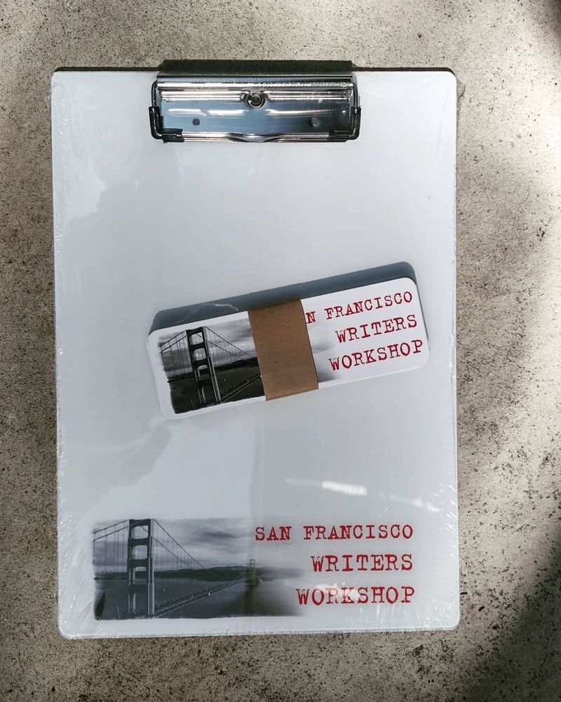 A clipboard and bookmarks labeled "San Francisco Writers Workshop"