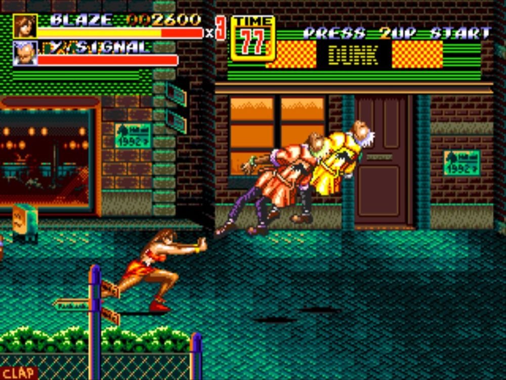 Screenshot of Streets of Rage 2. Blaze is attacking two Signal enemies using a Kikosho