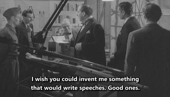 Black and white film scene showing several men in suits and uniforms in a laboratory, with subtitle text reading "I wish you could invent me something that would write speeches. Good ones."