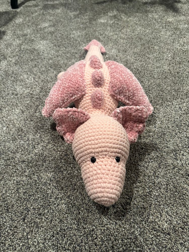 top front view of the pink dragon plushie i crocheted