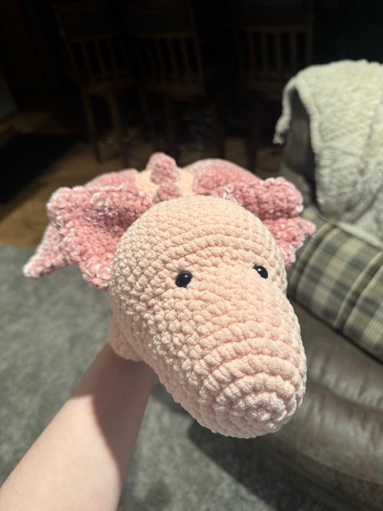 pink dragon plushie i crocheted!! this angel shows me holding the plushie